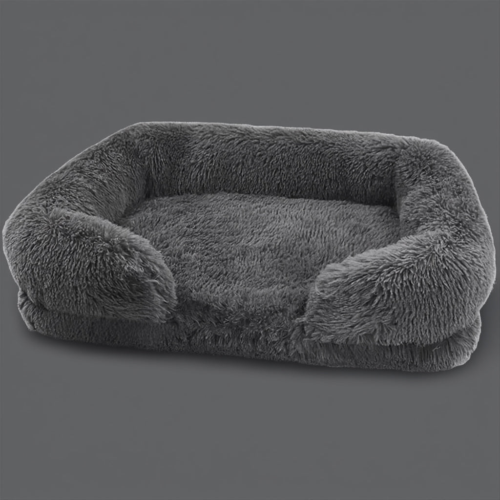 Soft plush pet bed with raised calming edges